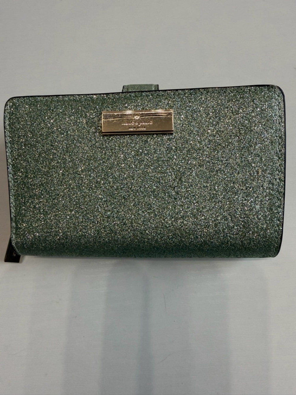 Kate Spade mint green glitter continental wallet with gold-tone logo